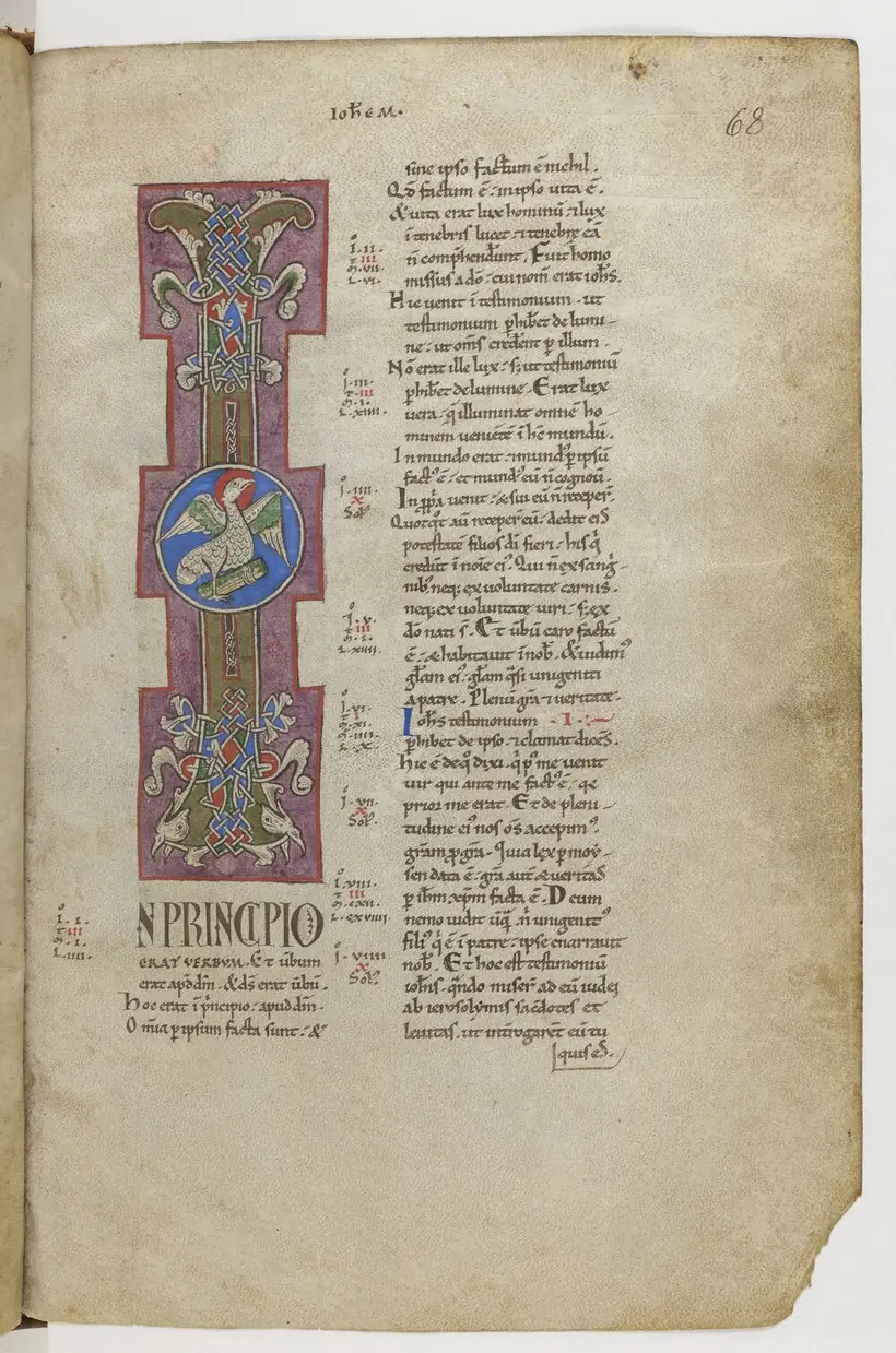 A twelfth-century page opening the Gospel of John, with a tall painted initial I enclosing an eagle in a blue roundel.